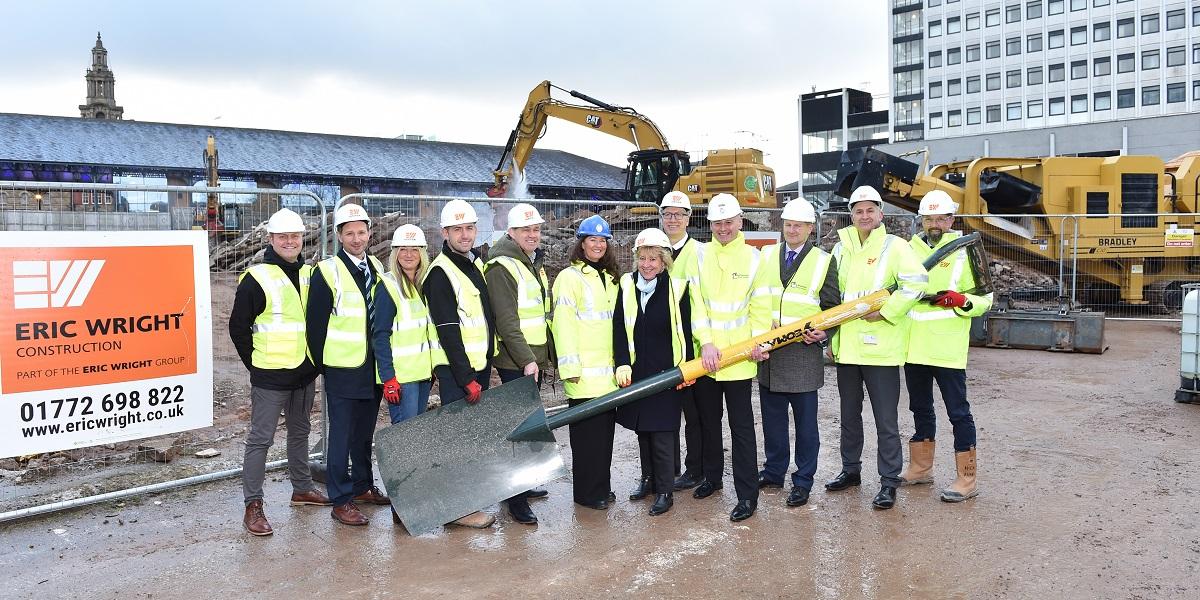 People holding large spade to mark work starting on Animate project