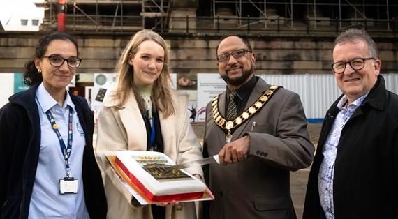 The Mayor of Preston cutting The Harris birthday cake