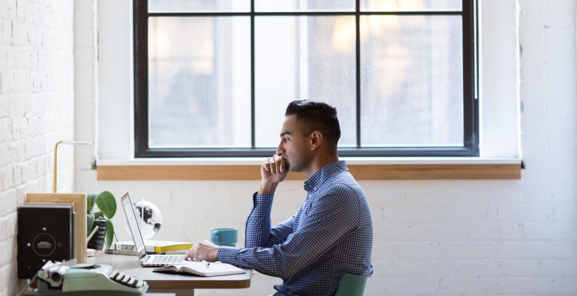 Young business man working on laptop 