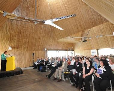 People listening to a presentation inside Brockholes Conference space