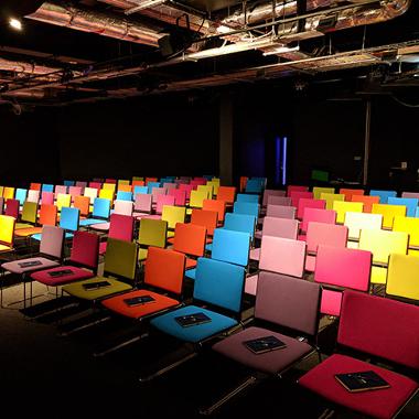 EKM auditorium space with colourful chairs