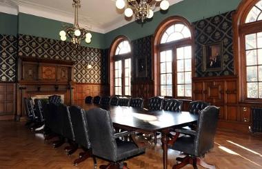 Chairs around a long table inside Twelve Teller's meeting room